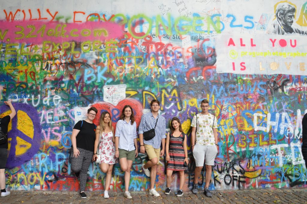 The team in front of the Lennon wall in Prague.